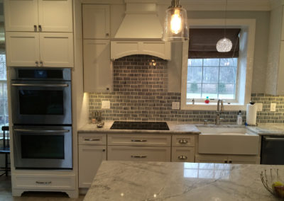Kitchen remodel with gray subway tile cooktop and range hood Moorestown NJ