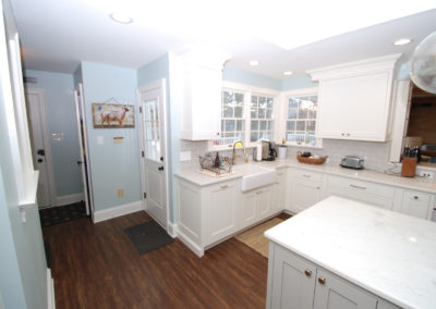 Classic farmhouse style kitchen with white cabinetry and wood floors Kitchen remodel Moorestown NJ