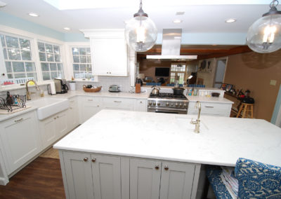 Kitchen remodel with custom island bar sink globe lights and range hood Moorestown NJ