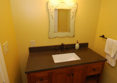 Powder room vanity with mirror and sconce