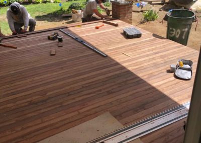 Contractors Laying porch flooring in Moorestown NJ