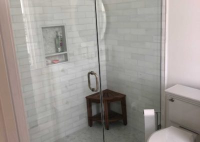 Curbless Shower with frameless doors and bench