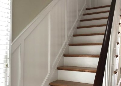 Custom millwork by Moorestown, NJ contractor lines the staircase in this historic renovation
