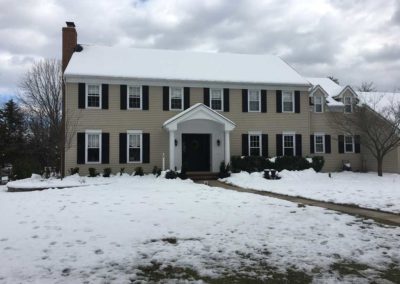 New porch roof adds elegance to this front entryway