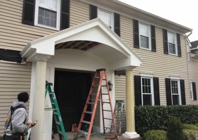 Local contractors install shiplap inside this new porch roof