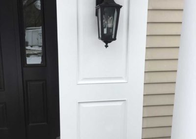 Adding shutters and lantern light fixtures add elegance and prestige to the front entryway