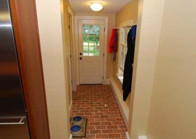 Hallway adjacent to the kitchen transformed into a functional mudroom by Moorestown NJ contractor