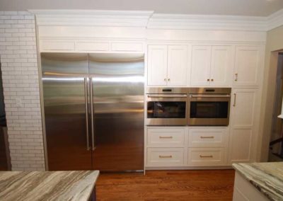 Kitchen remodel by Moorestown NJ contractor features extra wide built-in refrigerator and double wall ovens