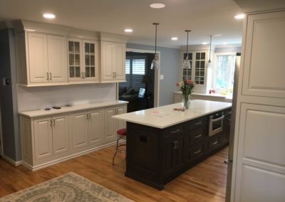 Elegant kitchen remodel with classic white subway backsplash, two toned cabinetry, and marble counters in Moorestown, NJ