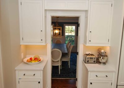 Built in cabinetry surrounds entrance to dining room