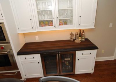 Butler's pantry with wine fridge and beautiful wood countertop by kitchen remodelers in Moorestown NJ