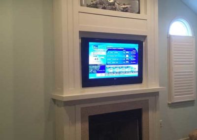 Custom living room built-in media center above fireplace in Moorestown, NJ