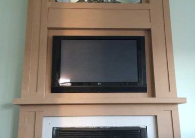 Custom fireplace surround with TV above the mantle by the Snyder Group Construction Company Moorestown NJ