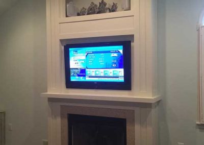 Custom fireplace surround with TV by the Snyder Group Construction Company Moorestown NJ